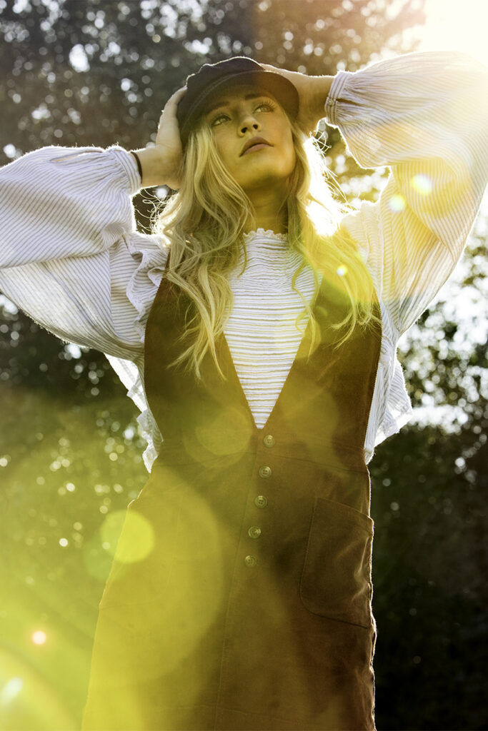 IMTA portfolio photo for model-actress Savannah O'Hara. Golden backlit, lens flare from bright sunlight. Gerard Harrison, photographer, Houston.