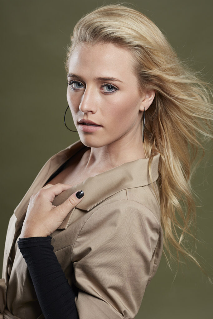 Acting headshot on olive background for beautiful young blonde model-actress.