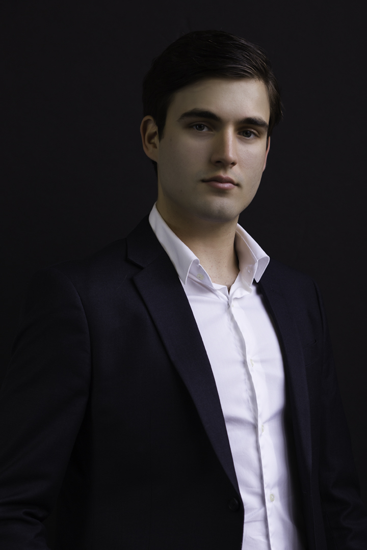 Professional business headshot of young male businessman by Gerard Harrison, Houston headshot photographer.