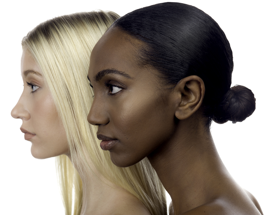 Blond model Sophie Heckman and Ethiopian model, Tsion Bekele, pose in profile wearing naturel look makeup for a cosmetics brand. Photo by Gerard Harrison, Houston fashion photographer.