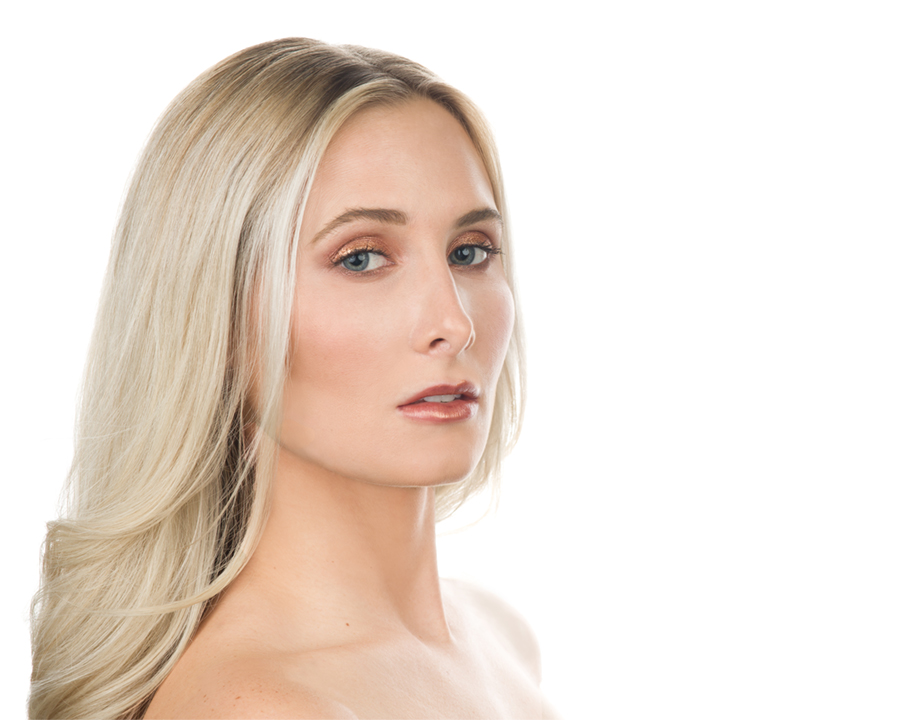 Beautiful blond model Jocelyn Joins wears a dramatic, but subtle evening look in an ad for a beauty brand. Gerard Harrison, Houston fashion photographer.