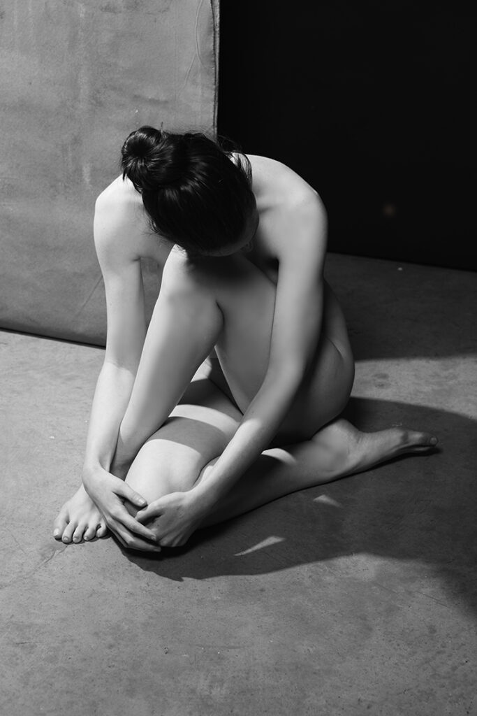 Black and white female nude study inspired by Edward Weston's famous 1930s photo.