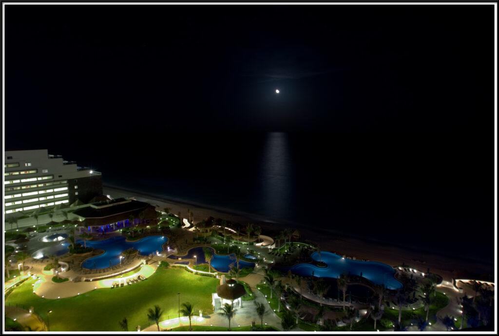 Moonrise over the Caribbean Sea from a balcony in the Marriott Cancun. Gerard Harrison, Houston fine art photographer