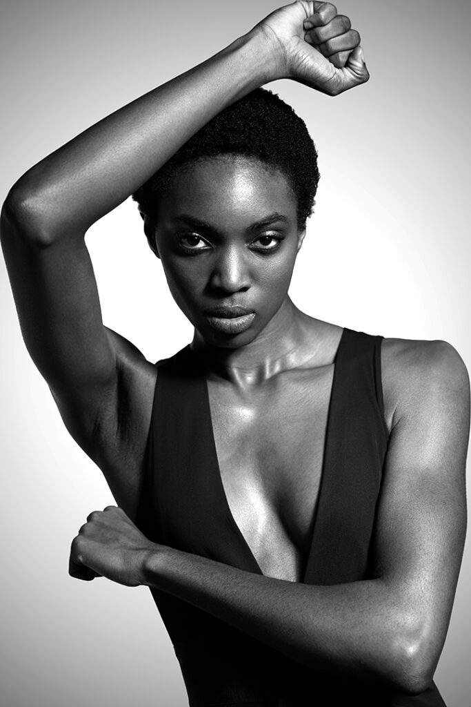 African female model strikes an angular pose during portfolio shoot with Houston model portfolio photographer Gerard Harrison