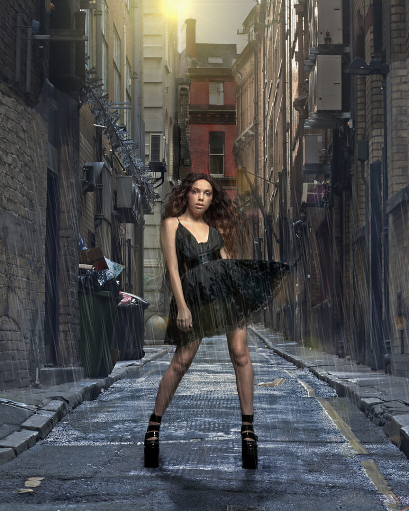 Into every life a little rain must fall. Conceptual image of young woman in the rain in a Paris backstreet.